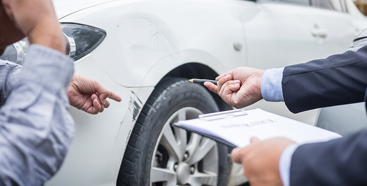 Car Insurance Attorney pointing at car